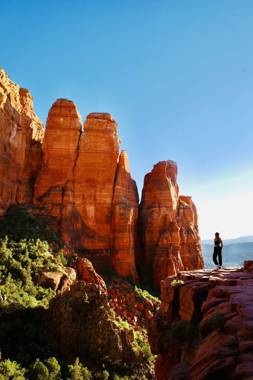 Alexa standing at the edge of red rock formations in Sedona